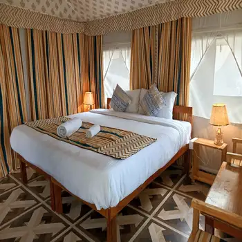 Handcrafted interior of a luxury glamping tent in Dharamshala at Beaumont Glamping