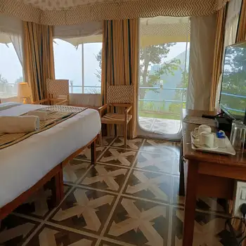 Cozy tent bedroom at the Himalayan retreat, Beaumont Glamping Dharamshala