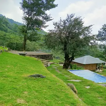 Panoramic Dhauladhar mountain view from a Beaumont luxury tent, Dharamshala